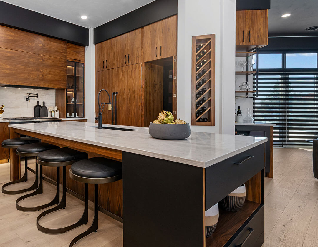 Walnut kitchen with large island and built-in wine rack